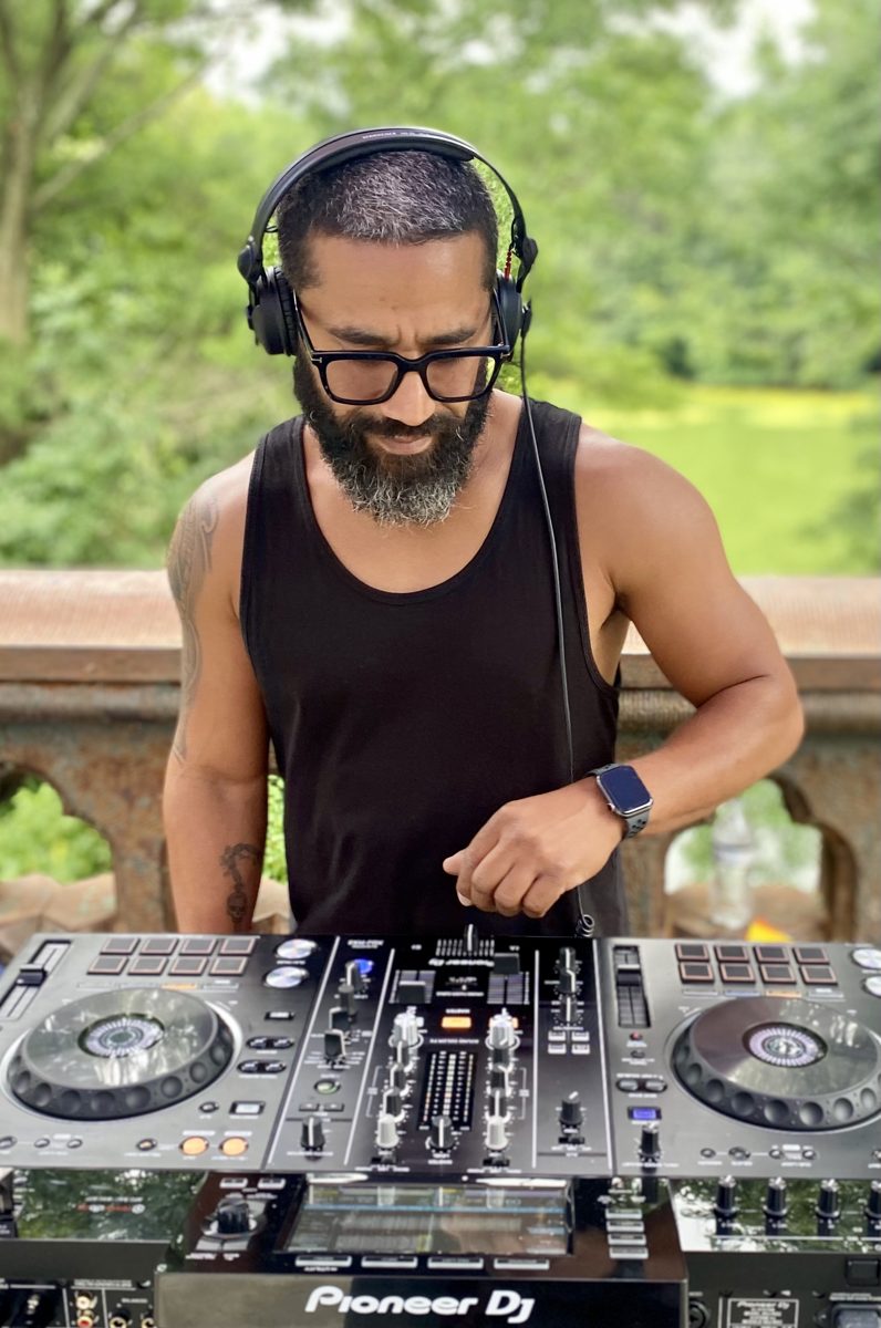 Danny Deleon DJing on Pioneer decks outdoors
